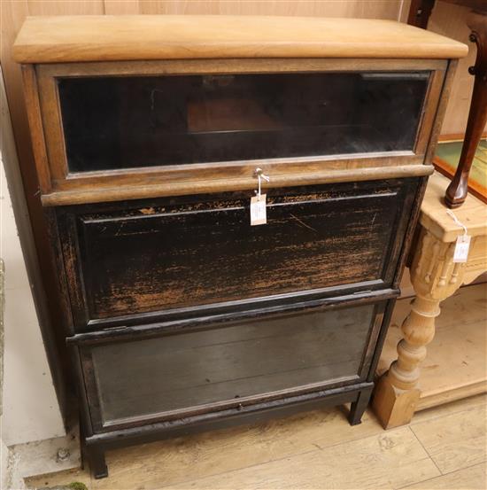 A Globe Wernicke type oak three section bookcase with fold-down desk W.88cm